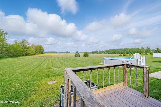 1106 S Grubb Rd, Lima, OH 45806 - wooden terrace with a rural view, a yard, and an outdoor pool