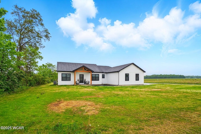 1771 Baty Rd, Lima, OH 45807 - modern farmhouse featuring a front lawn