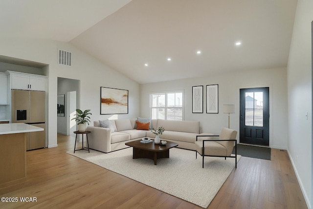 1771 Baty Rd, Lima, OH 45807 - living area featuring light wood finished floors, healthy amount of natural light, recessed lighting, and high vaulted ceiling