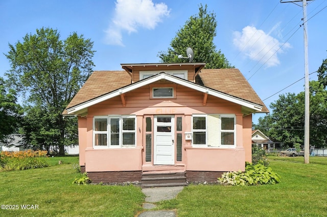 623 N Cherry St, Van Wert, OH 45891 - view of front of house with a front yard, stucco siding, and a shingled roof