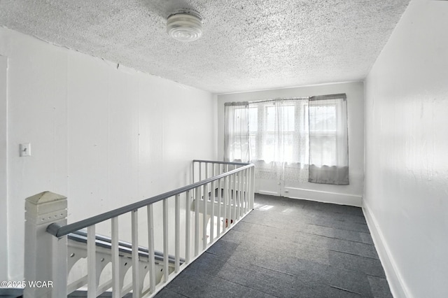 623 N Cherry St, Van Wert, OH 45891 - corridor featuring a textured ceiling, an upstairs landing, and carpet flooring