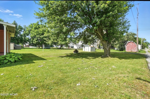 623 N Cherry St, Van Wert, OH 45891 - view of green lawn featuring a shed