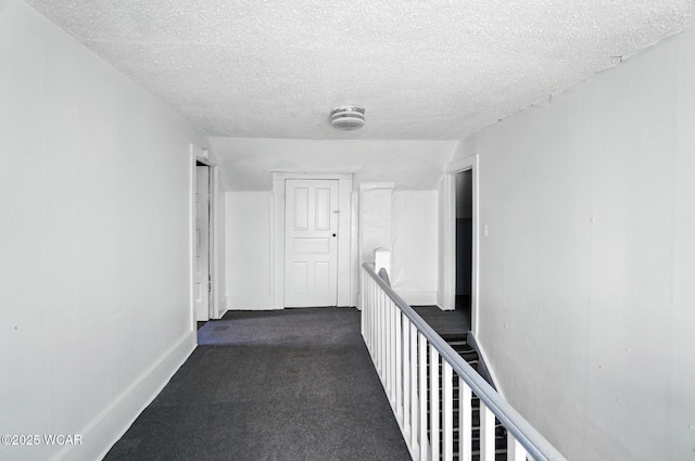 623 N Cherry St, Van Wert, OH 45891 - hall with a textured ceiling and dark colored carpet