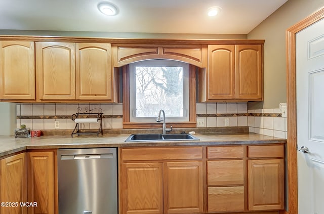 kitchen featuring light brown cabinetry, dishwasher, decorative backsplash, recessed lighting, and a sink