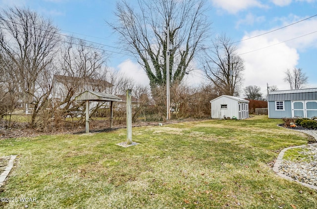 view of yard featuring a storage shed and an outdoor structure