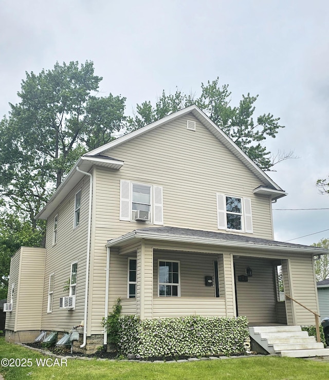720 S Metcalf St, Lima, OH 45802 - american foursquare style home featuring a porch and cooling unit