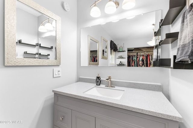 2435 Bible Rd, Lima, OH 45801 - bathroom featuring vanity and a walk in closet