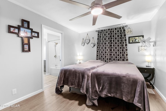 2435 Bible Rd, Lima, OH 45801 - bedroom featuring crown molding, wood finished floors, ensuite bath, and ceiling fan