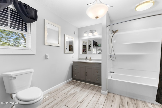 2435 Bible Rd, Lima, OH 45801 - full bathroom with vanity, bathing tub / shower combination, and wood tiled floors