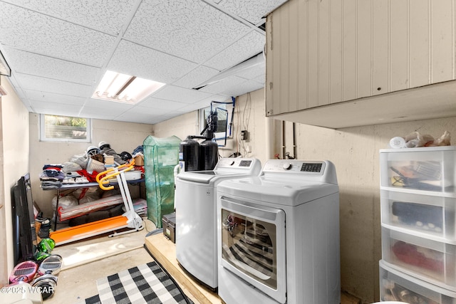 2435 Bible Rd, Lima, OH 45801 - washroom featuring separate washer and dryer and cabinet space