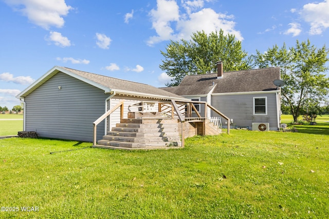 2435 Bible Rd, Lima, OH 45801 - back of property featuring a deck, a yard, a chimney, and stairs