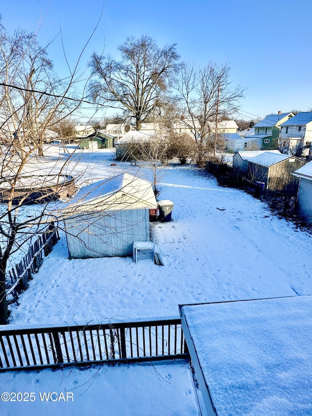 view of yard layered in snow