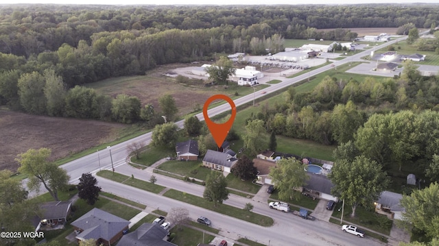 bird's eye view featuring a wooded view