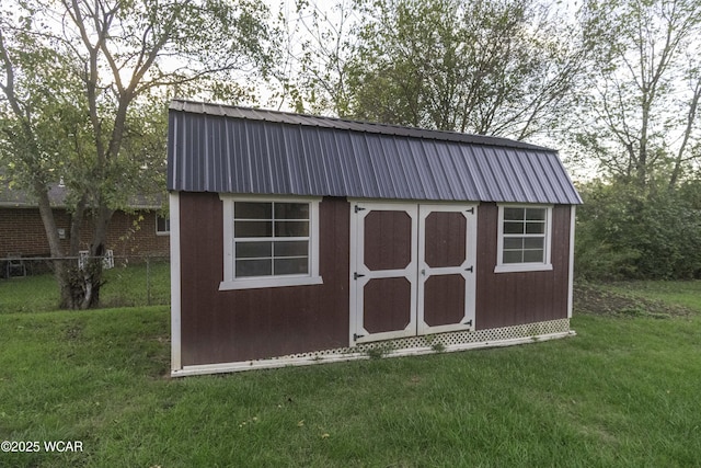 view of shed with fence