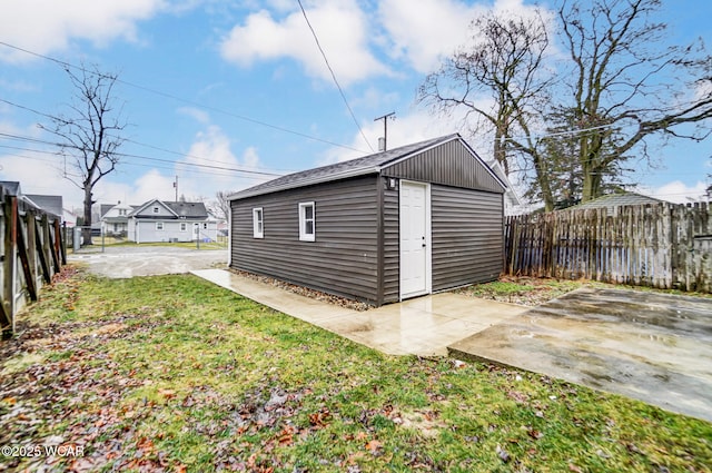 view of outbuilding with a lawn