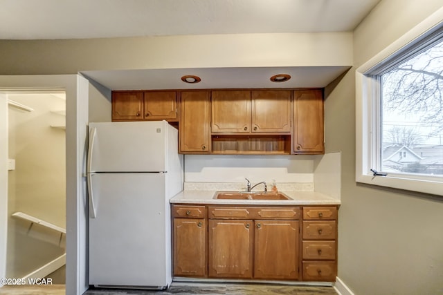 kitchen featuring sink and white refrigerator