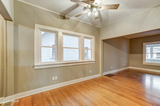 unfurnished room with hardwood / wood-style flooring and ceiling fan