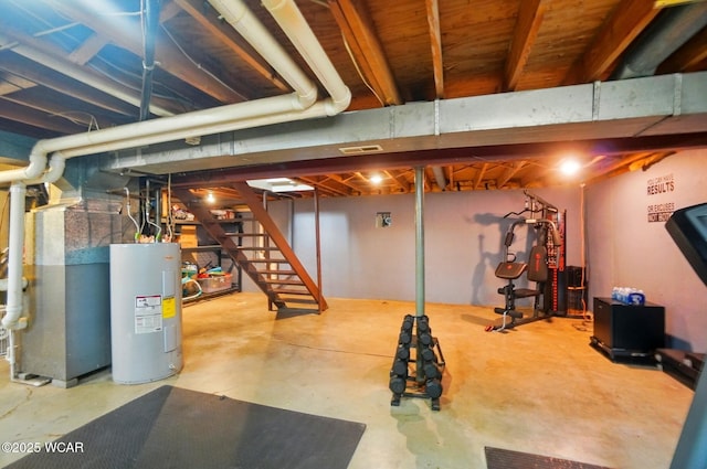 unfinished basement with stairs and water heater