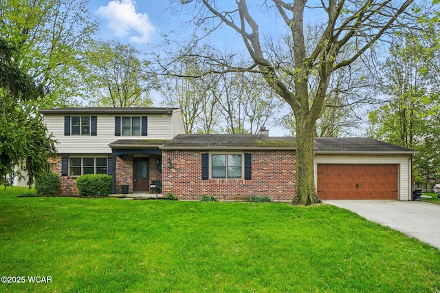 traditional home featuring an attached garage, brick siding, driveway, and a front yard