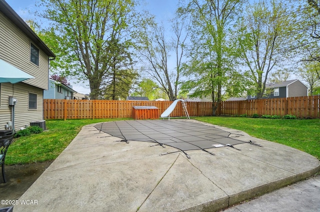 view of patio with a fenced backyard and central AC