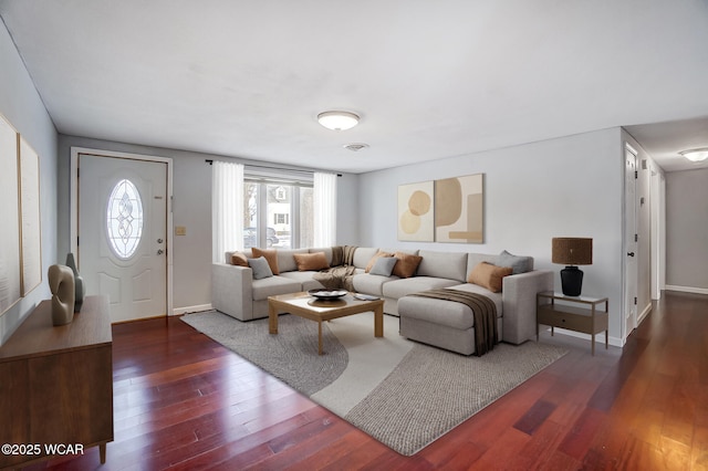 living room with dark hardwood / wood-style flooring