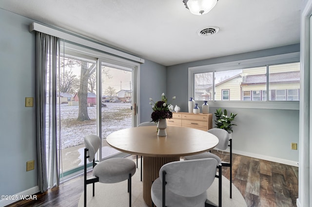 dining room featuring dark hardwood / wood-style flooring