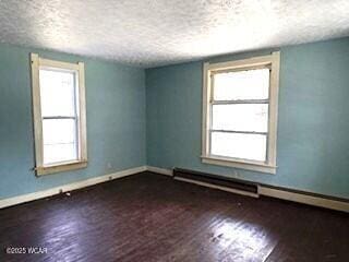 400 N Vance St, Carey, OH 43316 - unfurnished room featuring a textured ceiling and wood finished floors