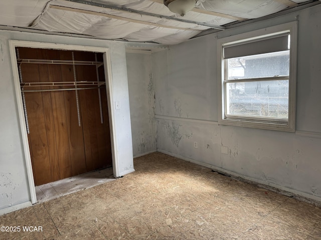 unfurnished bedroom with a closet