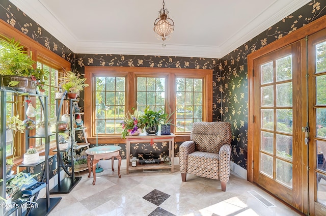 living area featuring ornamental molding and french doors