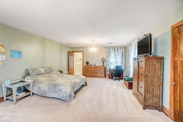 bedroom with ensuite bathroom and light colored carpet