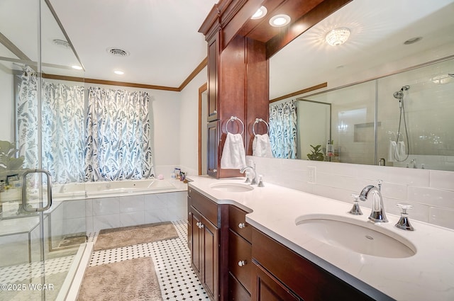 bathroom with tile patterned floors, crown molding, vanity, independent shower and bath, and backsplash