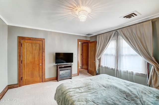 carpeted bedroom featuring crown molding