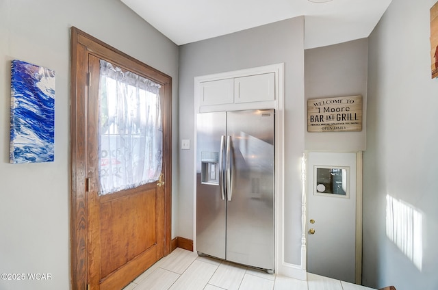 kitchen featuring stainless steel fridge