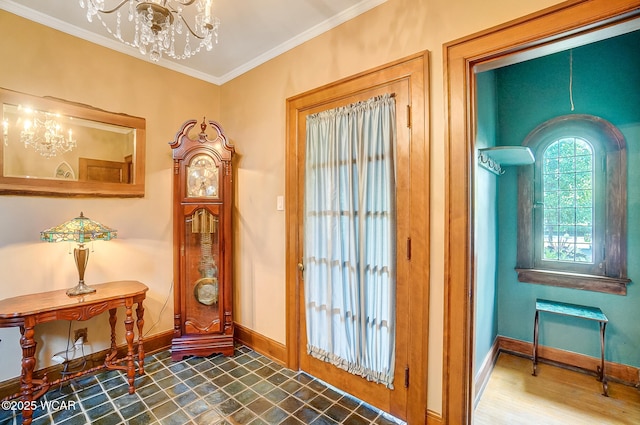 doorway to outside featuring wood-type flooring, ornamental molding, and a chandelier