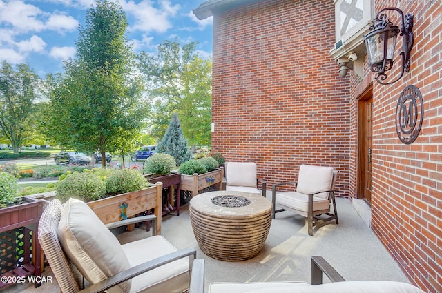 view of patio / terrace with a fire pit