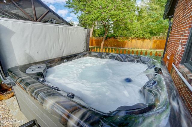 exterior space featuring a hot tub