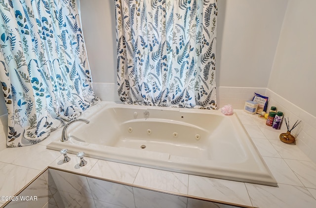 bathroom with tiled bath