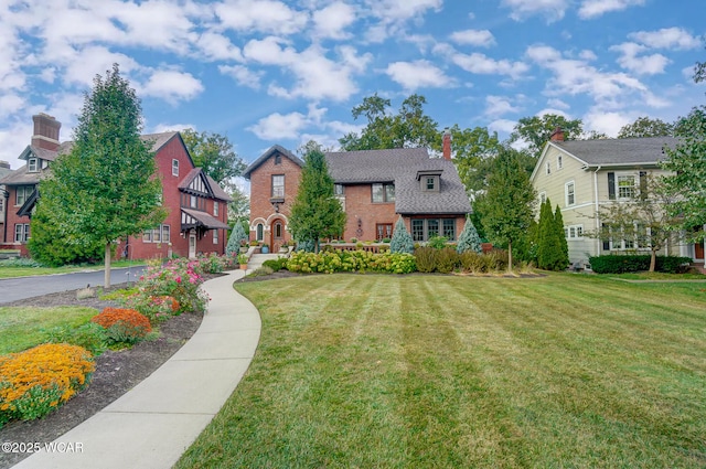 view of home's community featuring a lawn