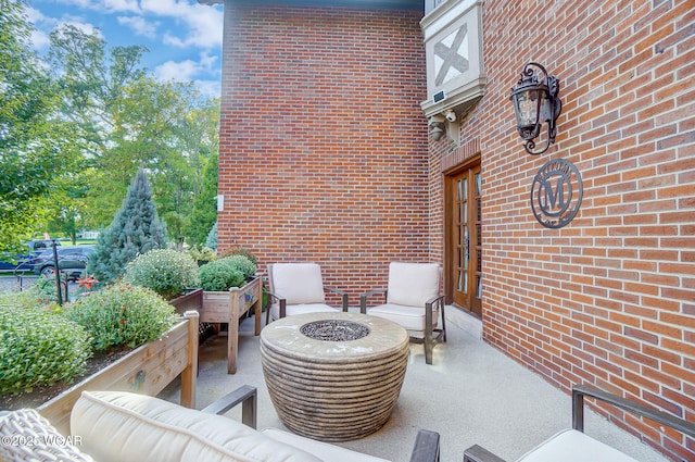 view of patio / terrace with a fire pit