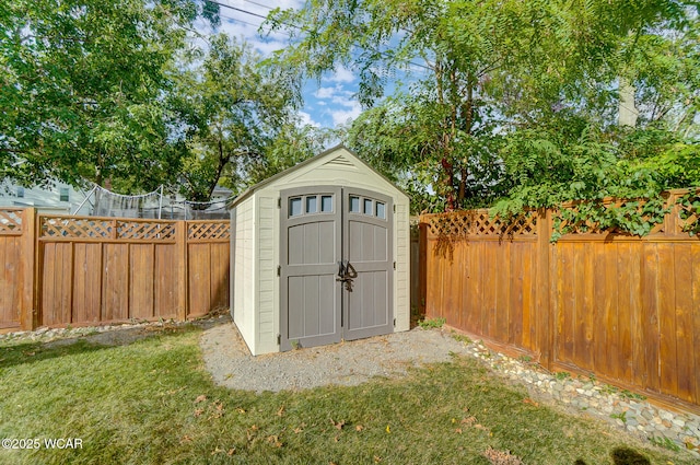 view of outbuilding featuring a yard