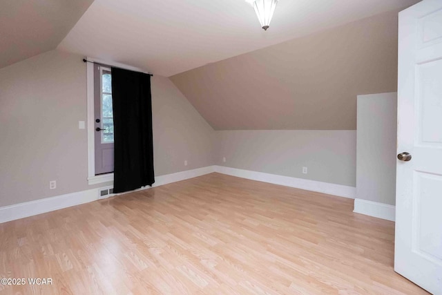 503 N Main St, Bluffton, OH 45817 - additional living space with light wood-type flooring and vaulted ceiling