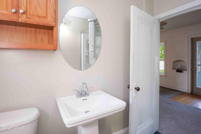 503 N Main St, Bluffton, OH 45817 - bathroom featuring a sink and wood finished floors