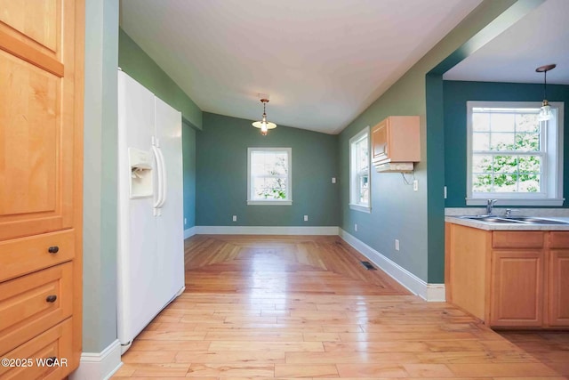 503 N Main St, Bluffton, OH 45817 - unfurnished dining area featuring light wood-style flooring and vaulted ceiling