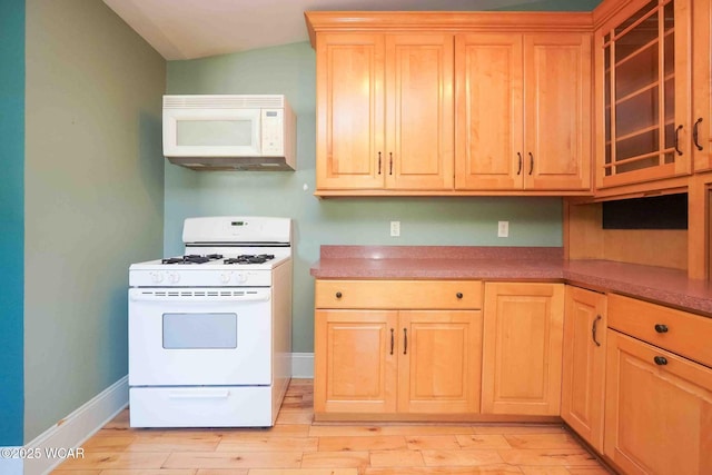 503 N Main St, Bluffton, OH 45817 - kitchen featuring white appliances, light brown cabinets, glass insert cabinets, and light wood-type flooring