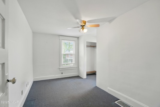 1161 Richie Ave, Lima, OH 45805 - unfurnished bedroom featuring carpet, baseboards, a closet, and a ceiling fan