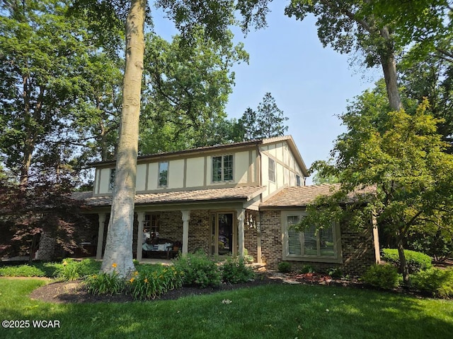3466 London Dr, Lima, OH 45805 - tudor home with brick siding and a front yard