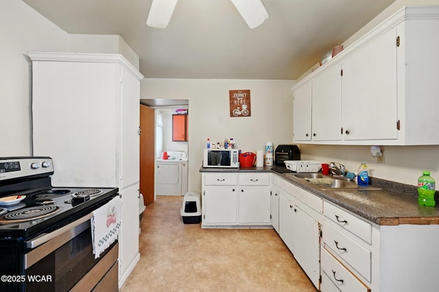 605 Hendricks Ave, Saint Marys, OH 45885 - kitchen with stainless steel electric range, white microwave, a sink, dark countertops, and white cabinets
