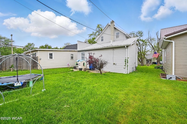 605 Hendricks Ave, Saint Marys, OH 45885 - back of property with a trampoline and a yard