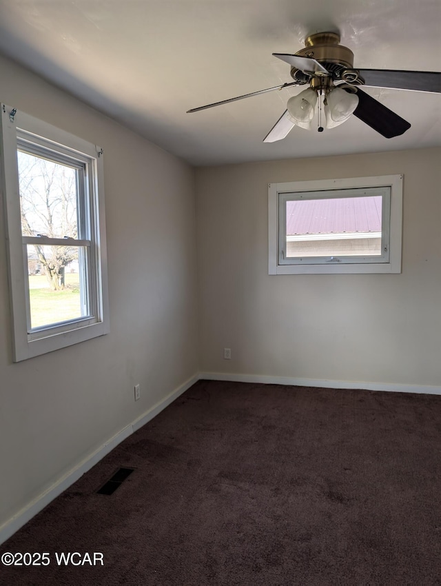 217 Center St, Vaughnsville, OH 45893 - spare room with visible vents, baseboards, a ceiling fan, and carpet flooring