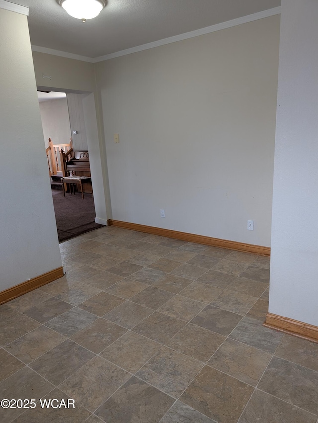 217 Center St, Vaughnsville, OH 45893 - spare room featuring stone finish flooring, baseboards, and crown molding